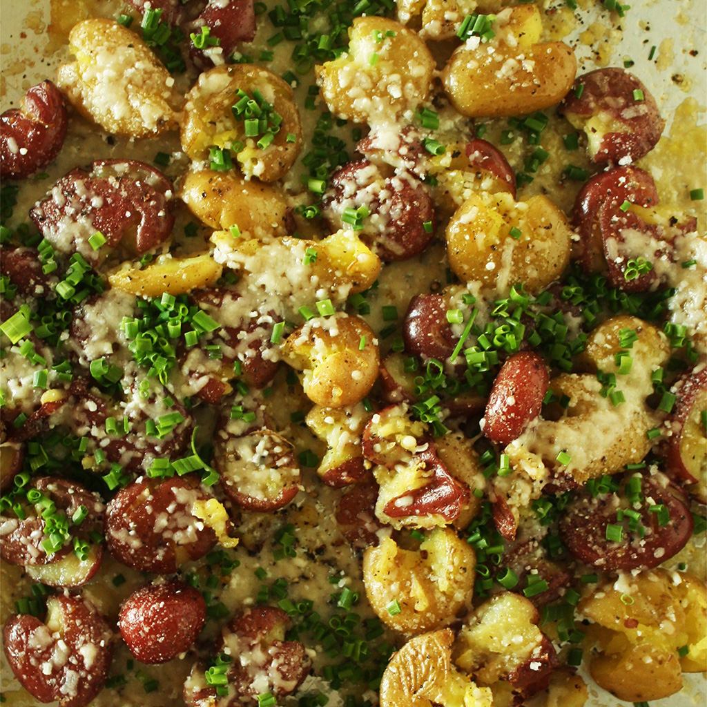 Smashed red and gold potatoes baked with melted fontina and a heavy scatter of fresh chives.