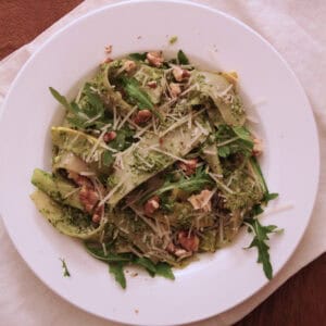 Pappardelle with zucchini ribbons, arugula walnut pesto, shaved parmesan and walnuts.