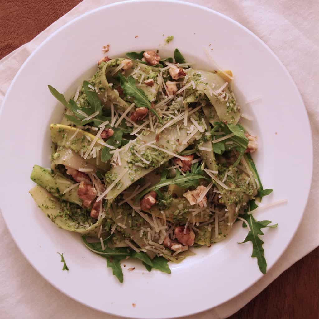 Pappardelle with zucchini ribbons, arugula walnut pesto, shaved parmesan and walnuts.